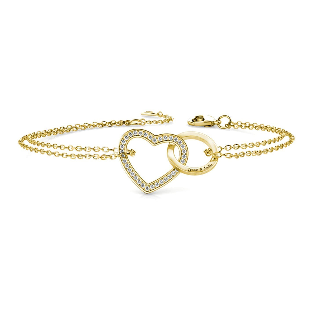 Armbånd i 925 sterling sølv med et forgyldt hjerte og en cirkel, der er flettet ind i hinanden.